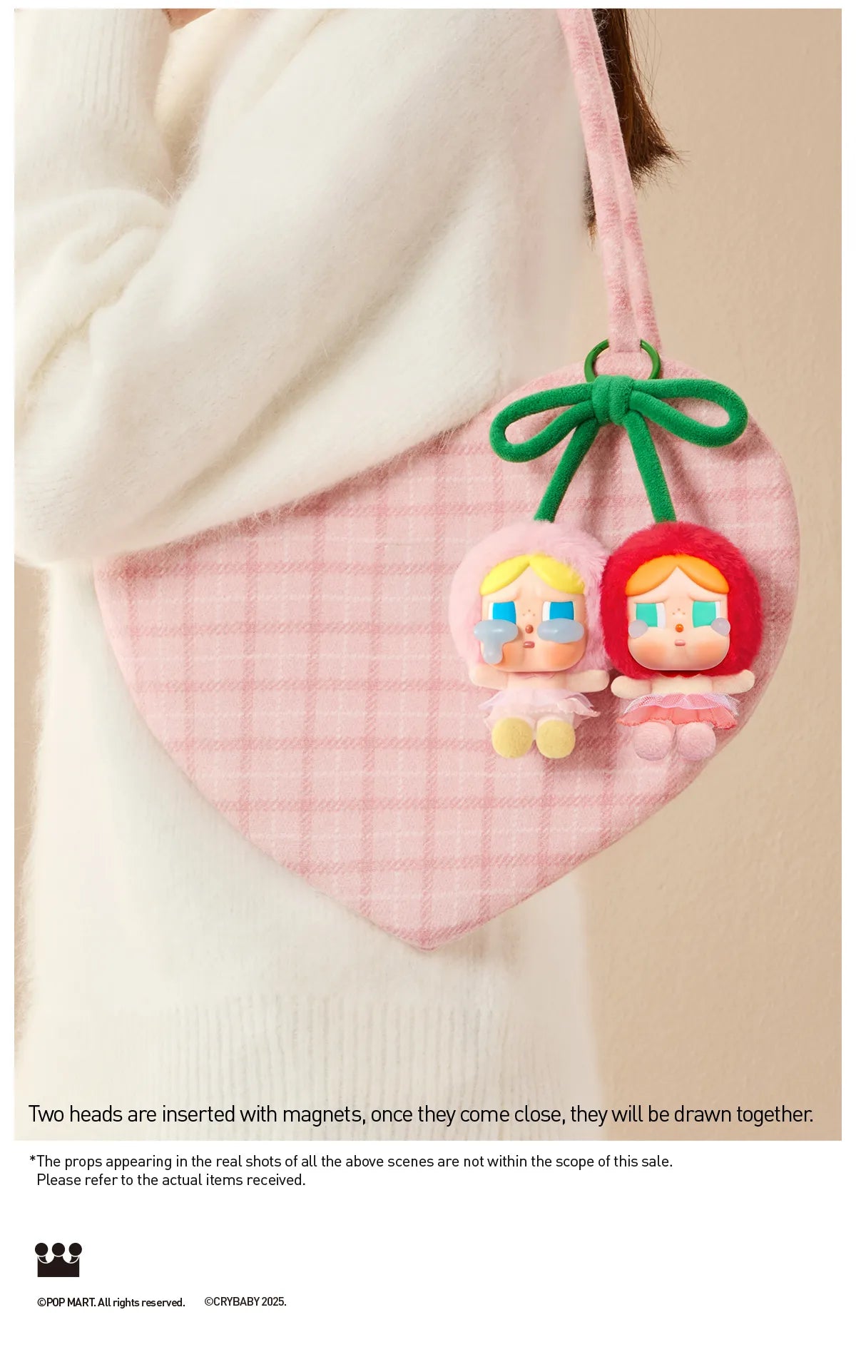 Pop Mart Cry Again Series, love you cherry much. Pink heart-shaped product with cartoon character heads on a beige background