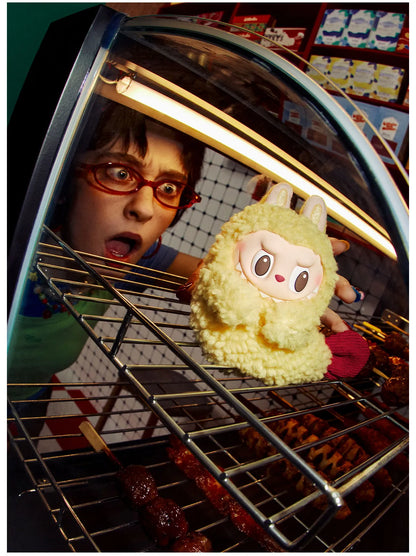 Popmart wacky mart series. Person with a surprised expression holding a plush toy inside an oven.