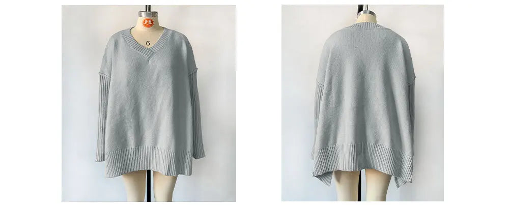 Gray sweater on a mannequin against a white background