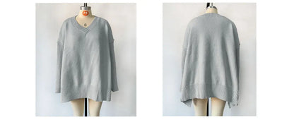 Gray sweater on a mannequin against a white background