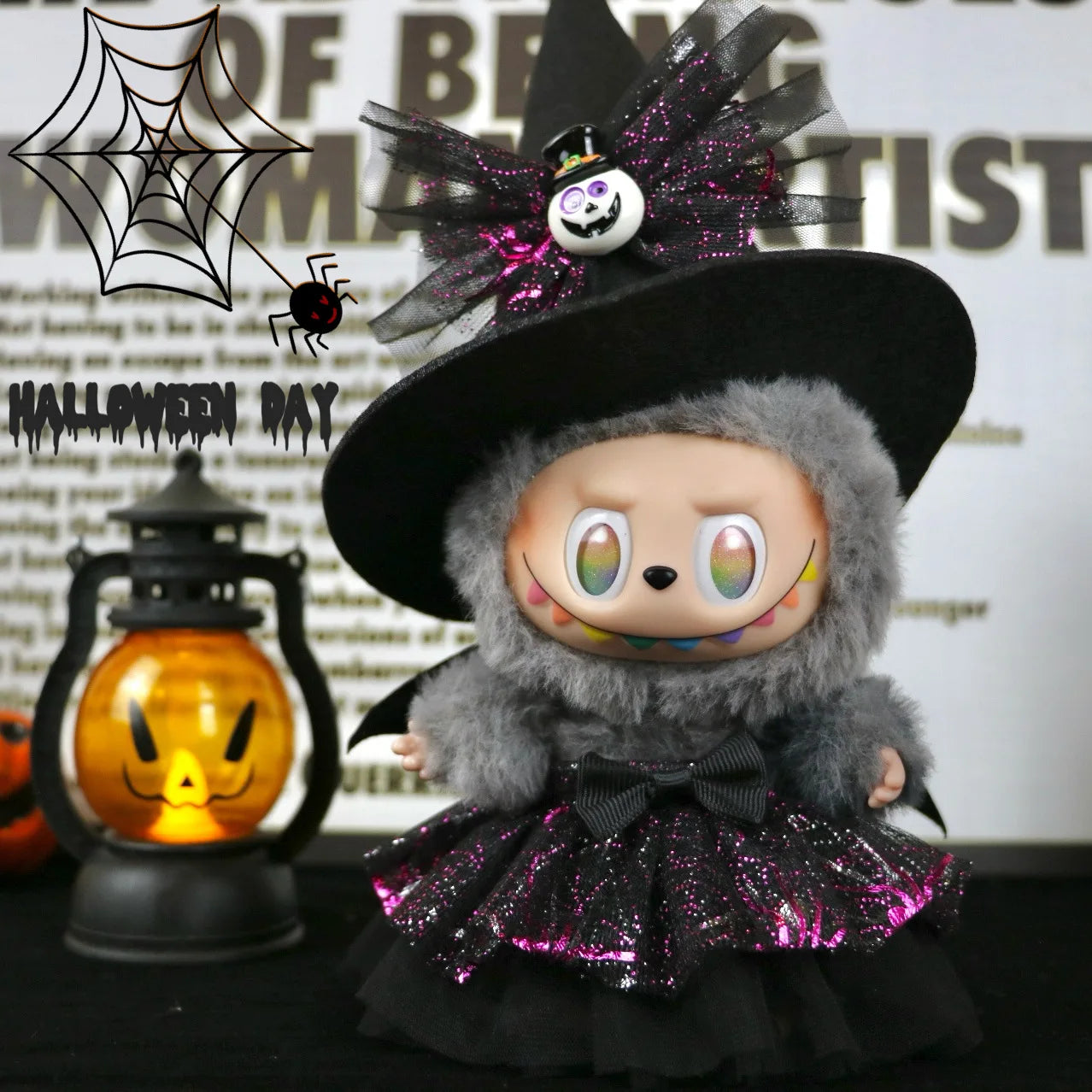 Labubu Halloween dress. Halloween-themed plush toy with witch costume and decorations, including a black hat and purple accents.