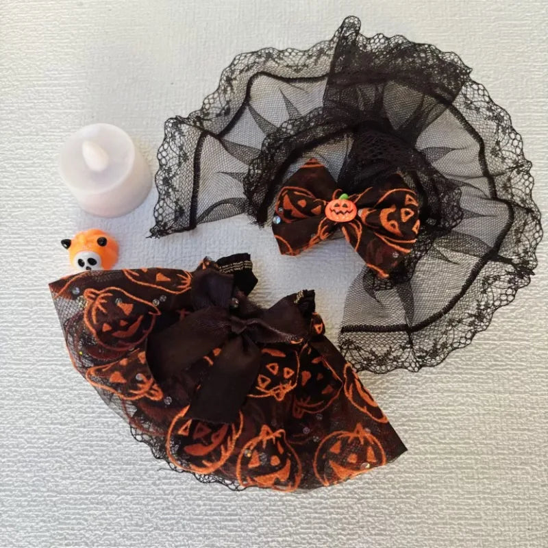 Labubu Halloween-themed hair accessories with black lace and pumpkin designs on a textured surface.
