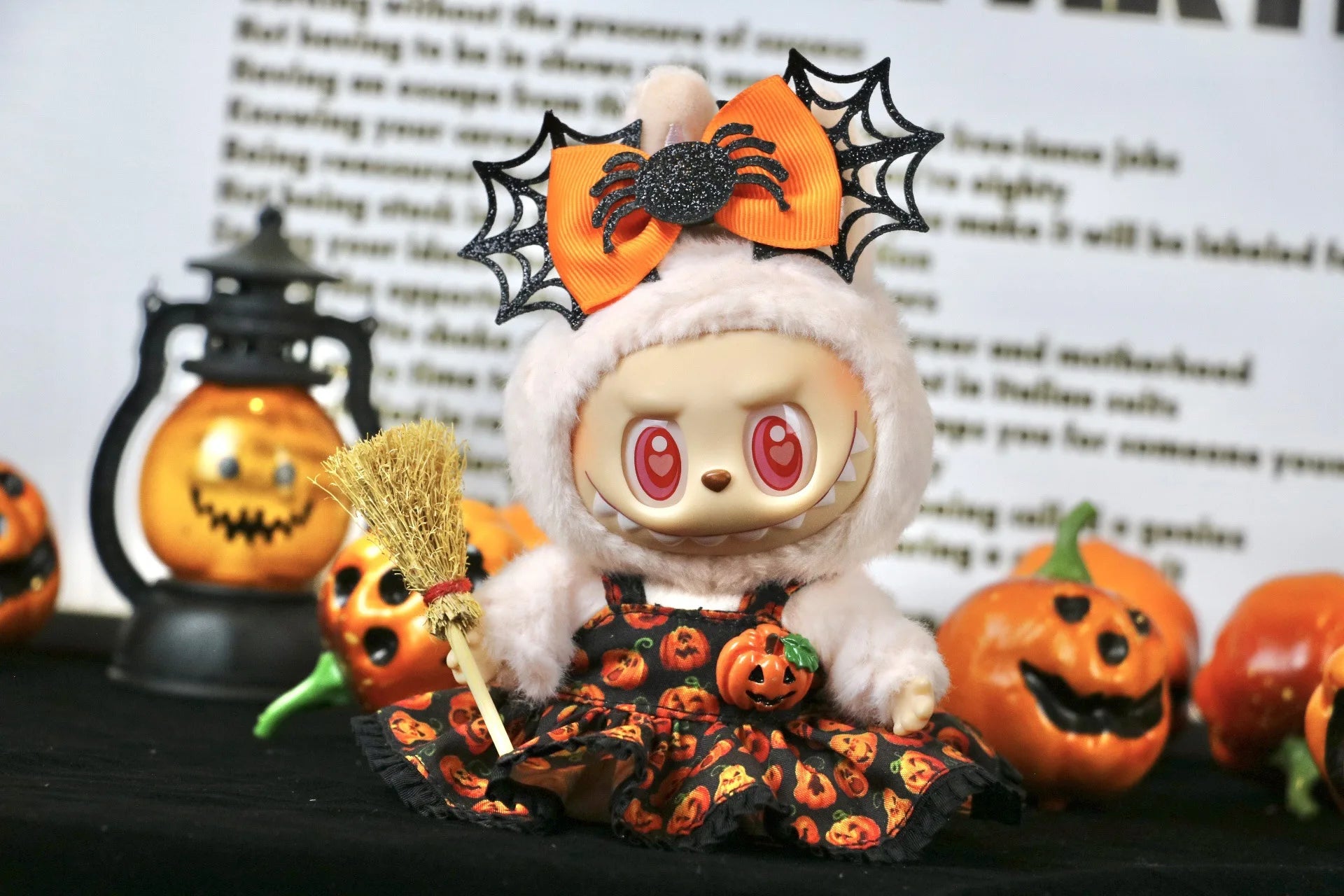 Labubu Halloween dress. Labubu in Halloween costume with pumpkins and spider decorations