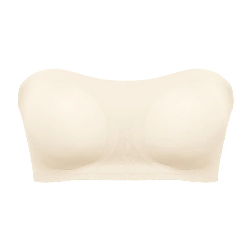 Beige strapless bra on a white background