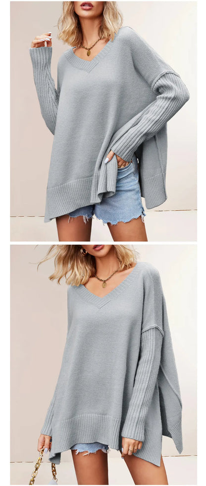 Light blue oversized sweater worn by a model with denim shorts on a plain background