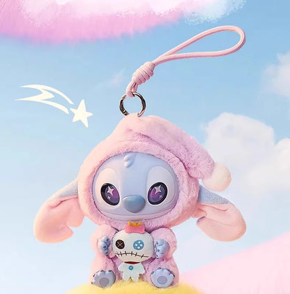 STitch Plush keychain of a cartoon character with a pink hood against a pastel sky background