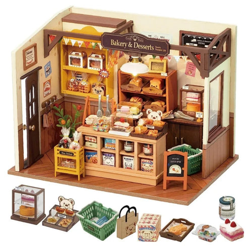 Toy bakery set with various items and accessories on a white background