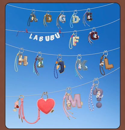 Labubu Pin for Love. Collection of colorful keychains with 'LABUBU' branding on a blue background