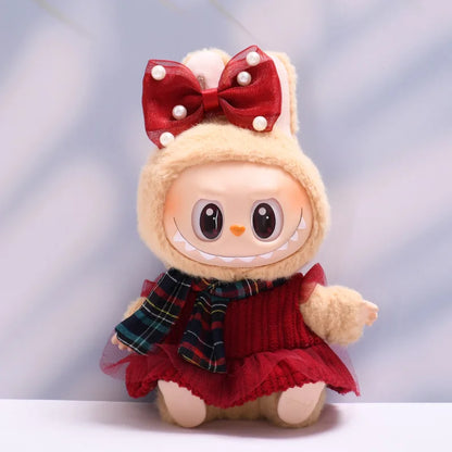 Labubu with a red bow and plaid scarf on a light gray background