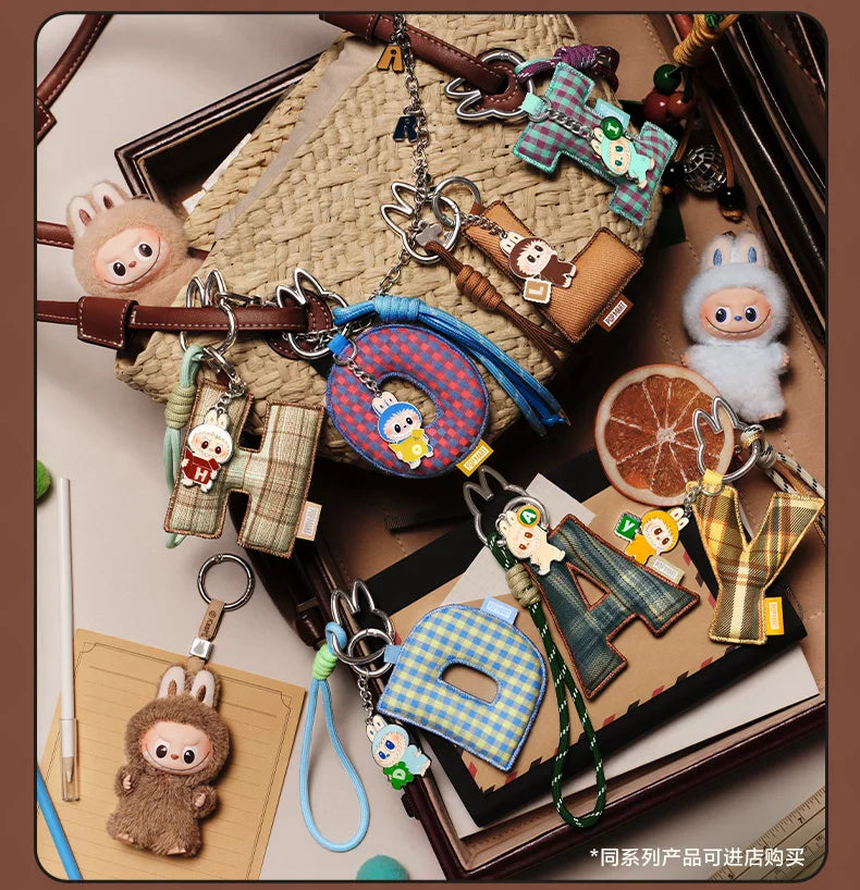 Labubu Pin for Love. Collection of various keychains and charms on a textured surface