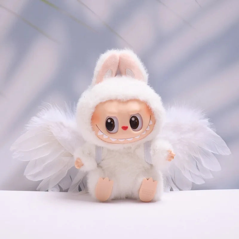 Labubu with a white outfit and fluffy wings on a light background
