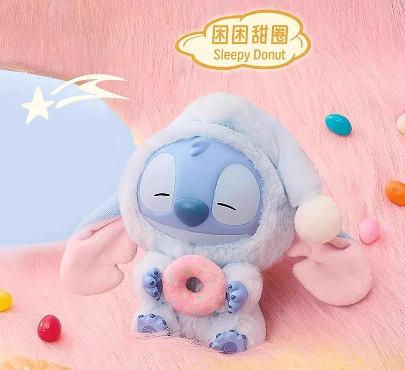 Plush toy resembling a character from 'Lilo & Stitch' with a donut, on a pink background with 'Sleepy Donut' branding.