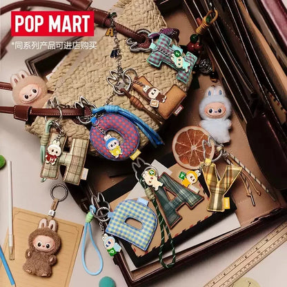 Labubu Pin for Love. Collection of various keychains and accessories with 'Pop Mart' branding.