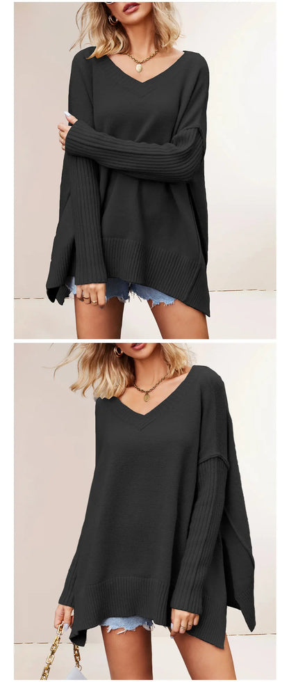 Black oversized sweater worn by a model on a plain background