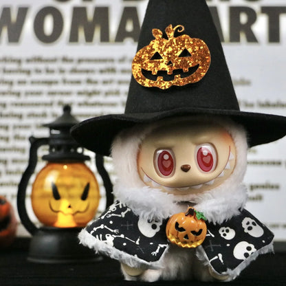 Labubu boots.Toy figure in a Halloween costume with a witch hat and pumpkin decorations, against a blurred background.