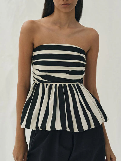 Monochrome Muse: A Strapless Beauty with Bold Stripes