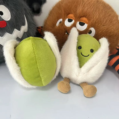 Jellycat pistachio. Plush toy resembling a character with a green ball and brown body on a white background