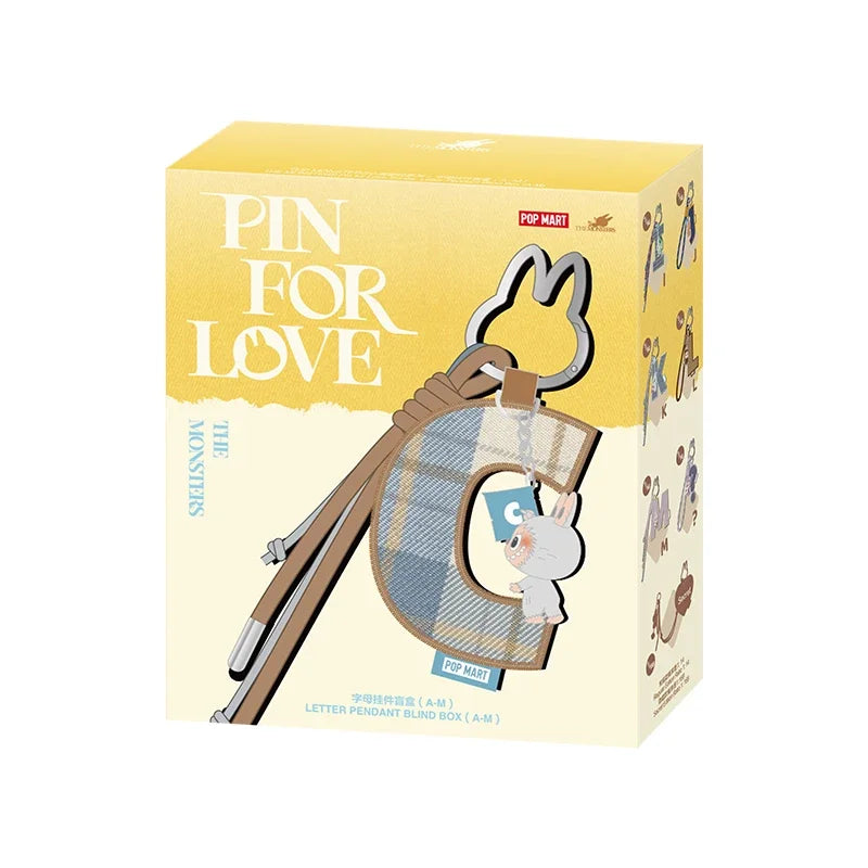 Labubu Pin for Love. Product packaging for 'Pin for Love' with a yellow and beige design.