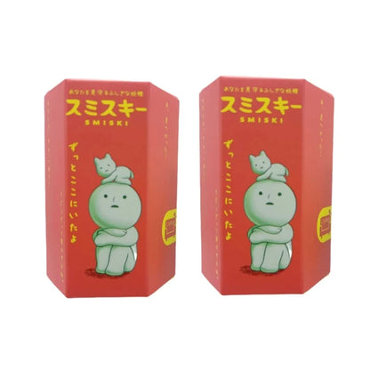 Two red boxes with a green cartoon character and 'SMISKI' branding on a white background.