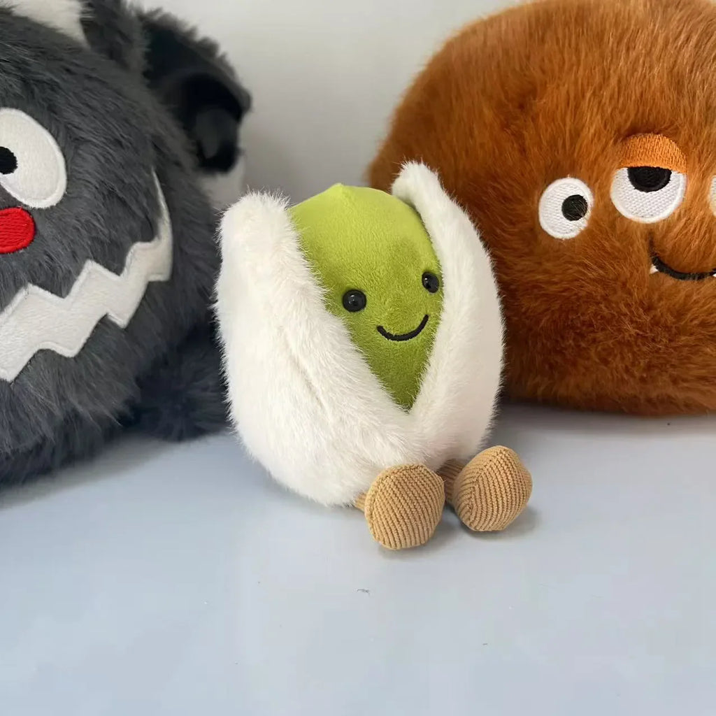  pistachio. Plush toy resembling a roll of sushi with a smiling face, surrounded by other plush toys on a light background.