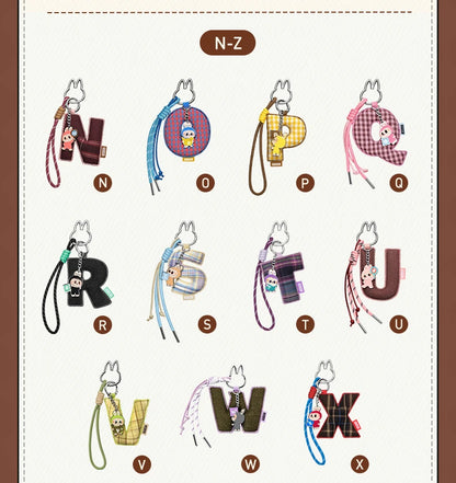 Labubu Pin for Love. Alphabet keychains from N to Z on a white background with a brown border.