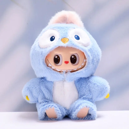 Labubu with a blue hood and white body on a light gray background