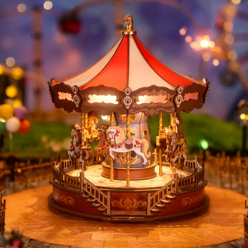 Decorative carousel model with colorful horses against a blurred amusement park background