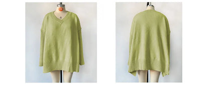 Green sweater on a mannequin against a white background