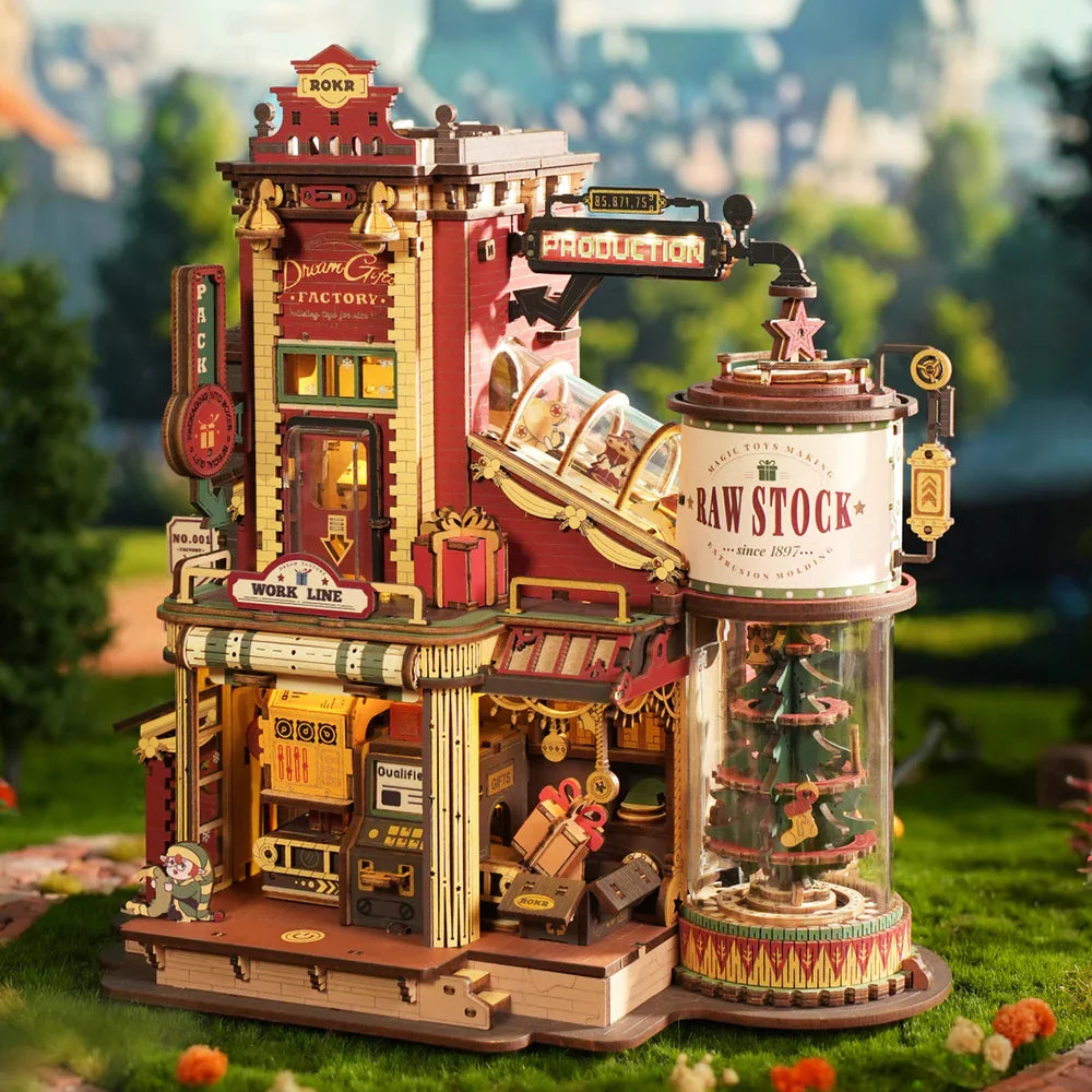 Detailed model of a vintage factory with a clear dome on a grassy background