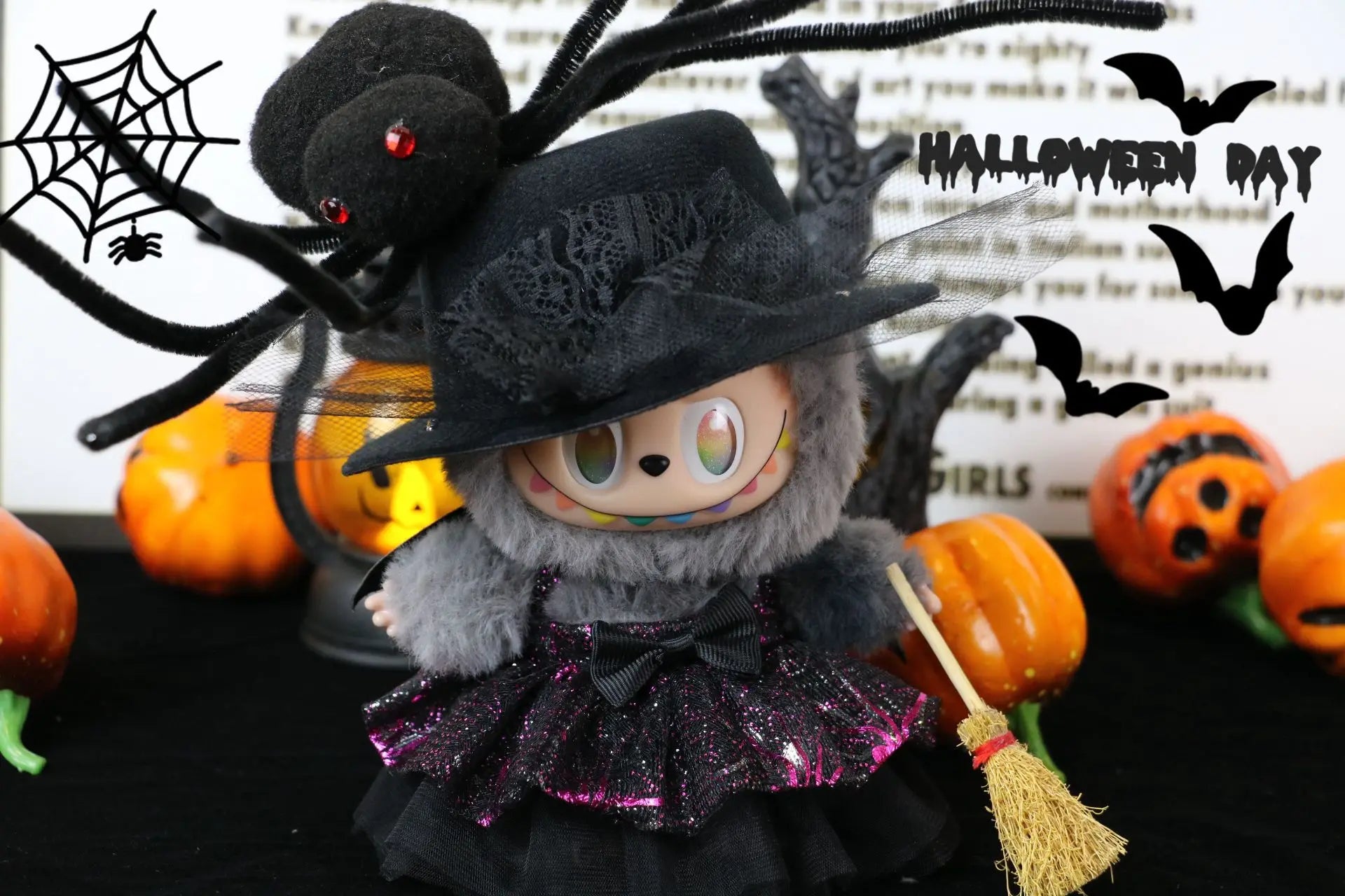Labubu Halloween dress. Halloween-themed plush toy with spider web, pumpkins, and text on a dark background