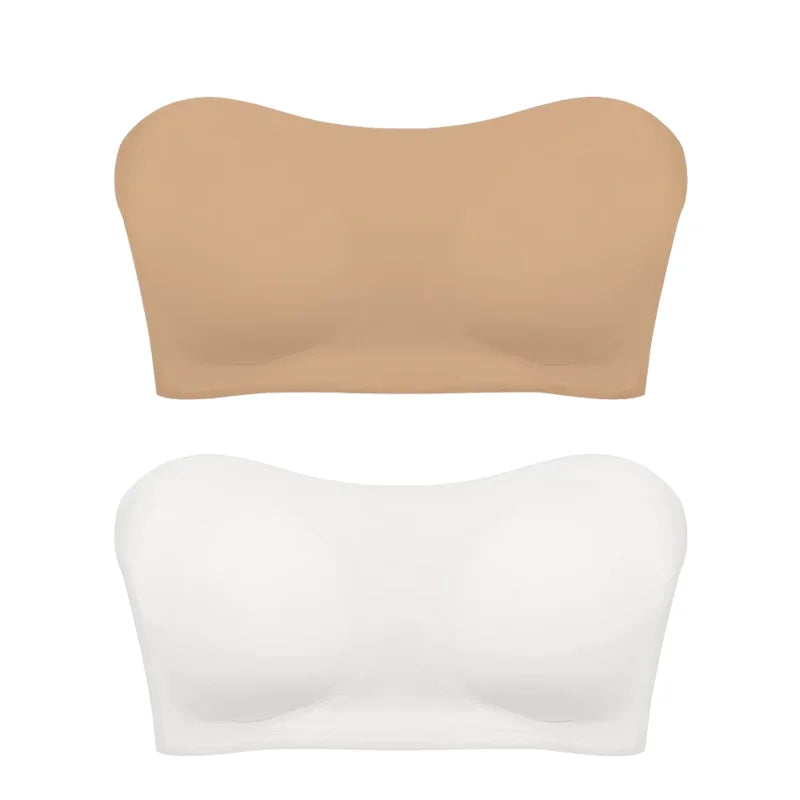 Two strapless bras, one beige and one white, on a white background