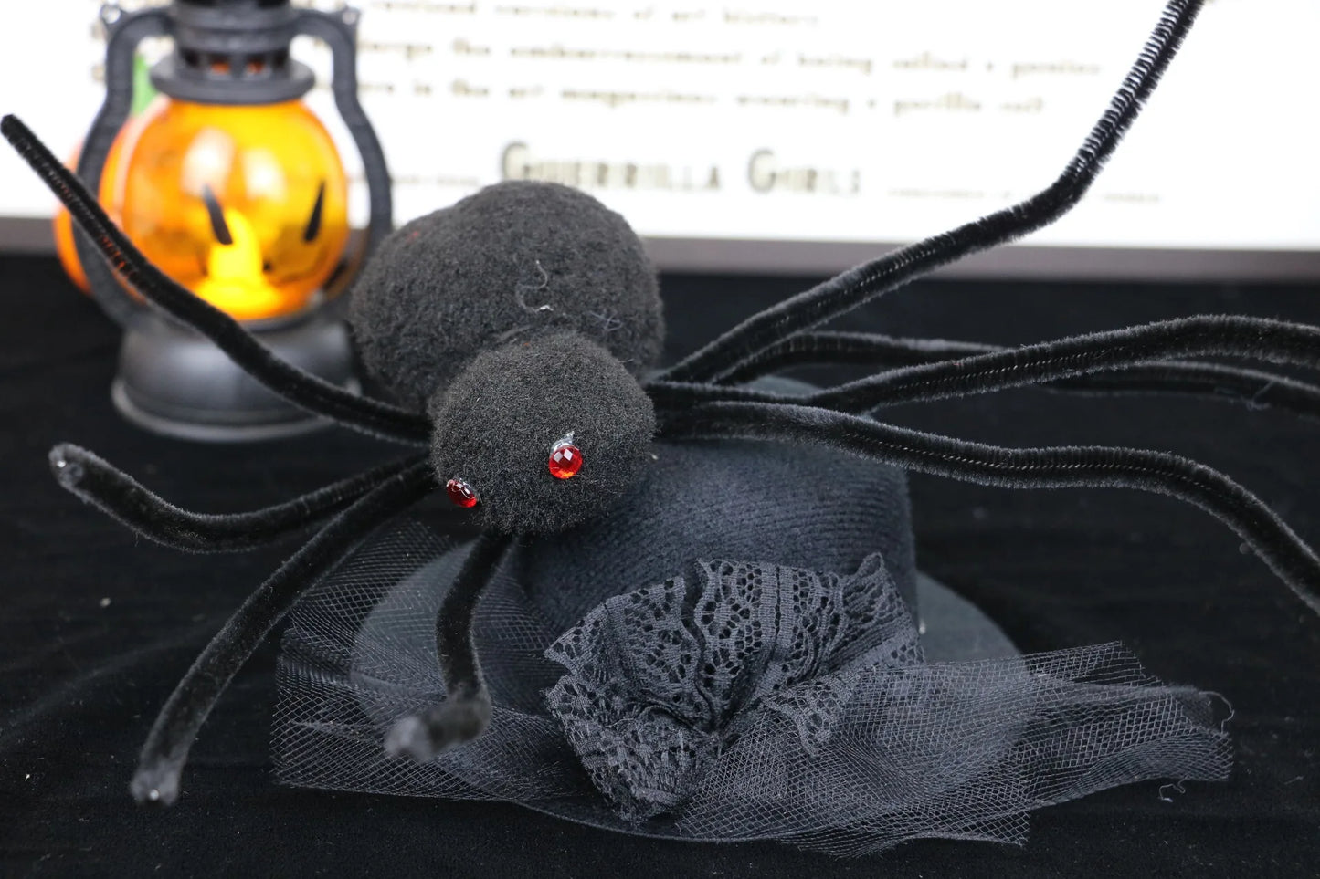 Labubu boots.Halloween decorative spider with a lantern in the background